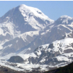 A high rocky snow-covered mountain
